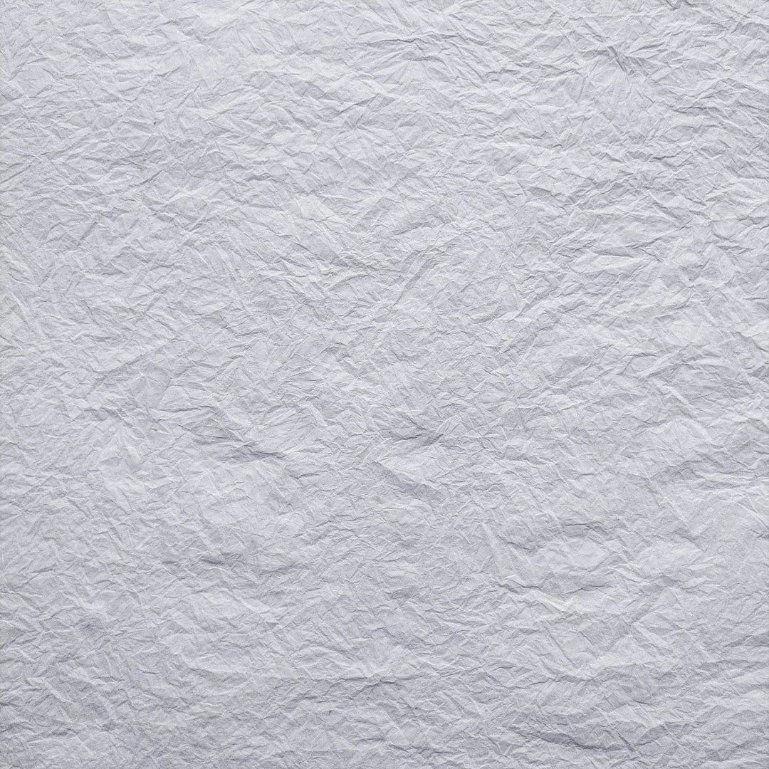 Handmade Momigami paper in white, crafted from mulberry fiber by Kozo Studio, perfect for gift wrapping and decorative art projects.
