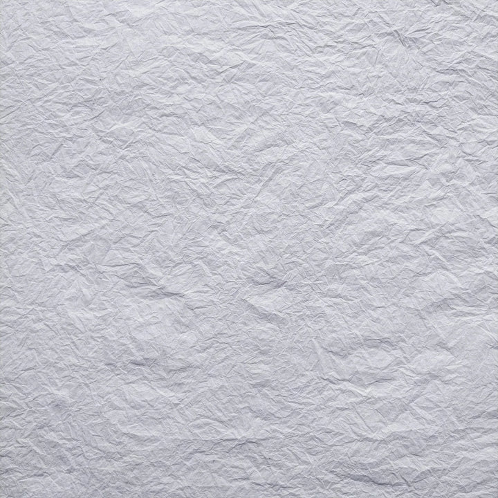 Handmade Momigami paper in white, crafted from mulberry fiber by Kozo Studio, perfect for gift wrapping and decorative art projects.