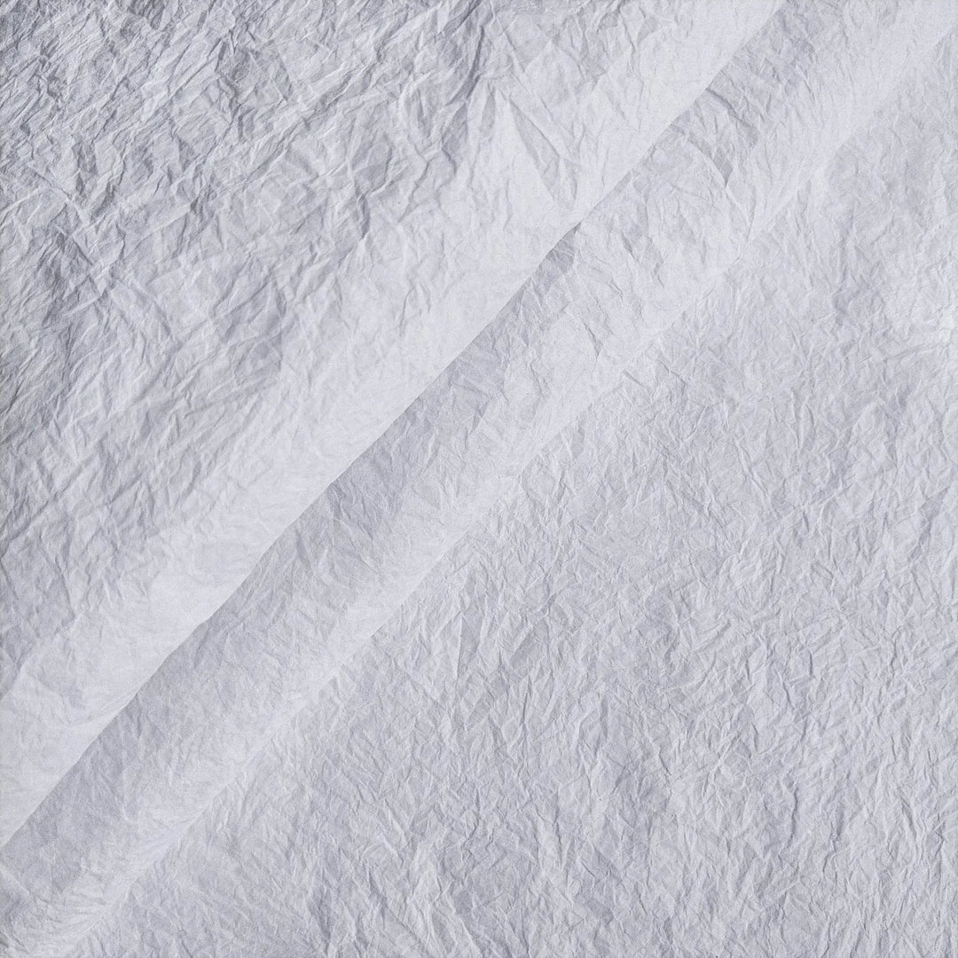 White Momigami mulberry paper with a crumpled finish, handmade by Kozo Studio for lampshades, packaging, and art projects.