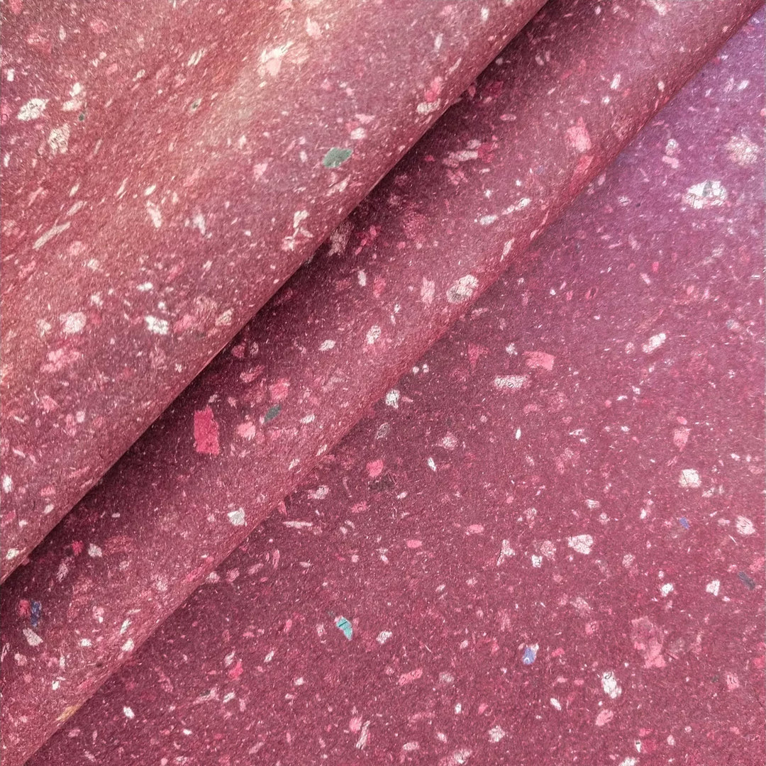 Medium-weight handmade mulberry paper created at Kozo Studio using eco-conscious methods. The surface shows tiny specks from recycled newspaper blended into kozo pulp.