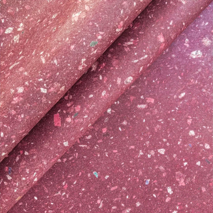 Medium-weight handmade mulberry paper created at Kozo Studio using eco-conscious methods. The surface shows tiny specks from recycled newspaper blended into kozo pulp.