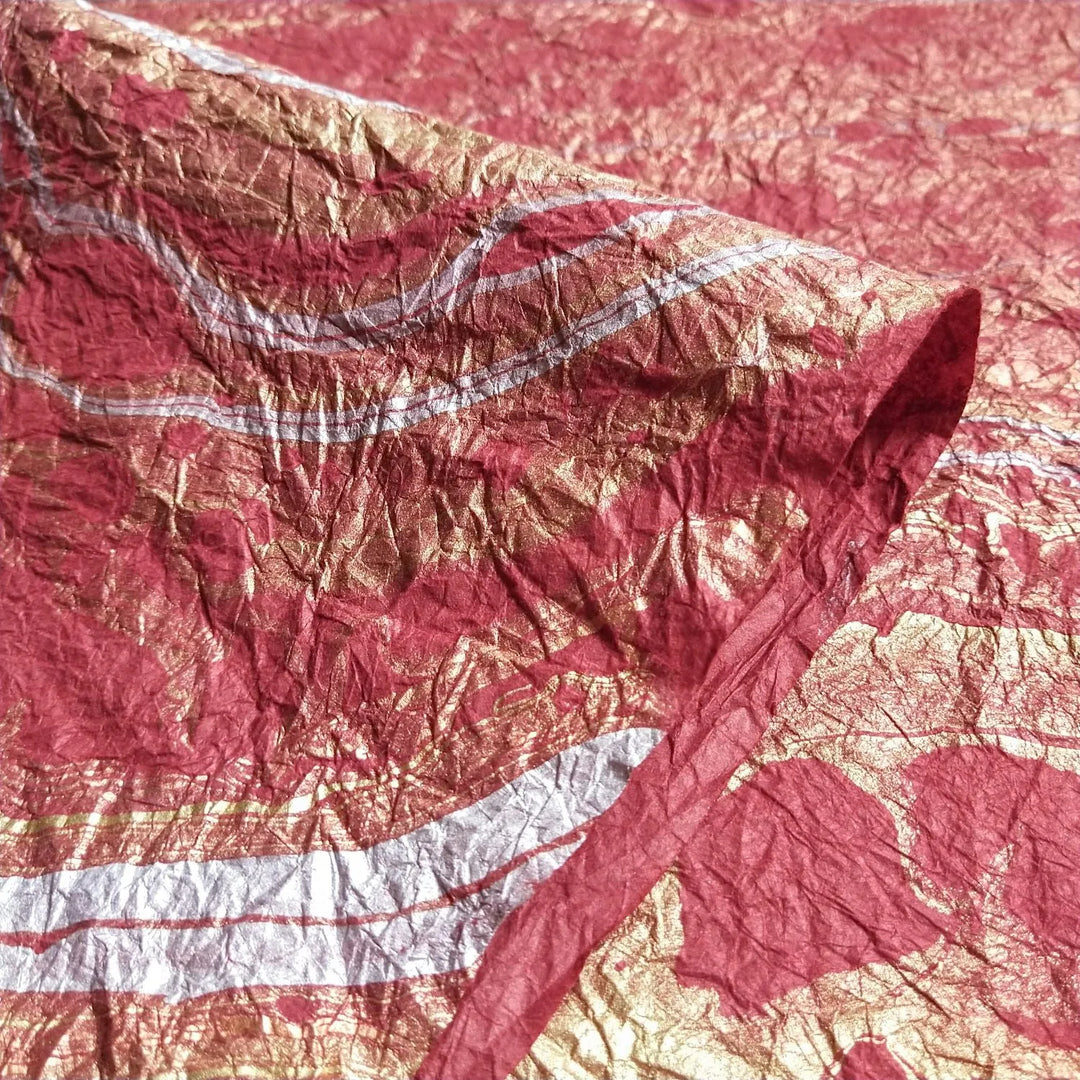 Decorative red handmade paper by Kozo Studio, featuring elegant marbling on crinkled mulberry paper perfect for fine art and creative projects