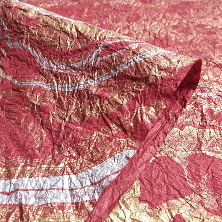 Decorative red handmade paper by Kozo Studio, featuring elegant marbling on crinkled mulberry paper perfect for fine art and creative projects