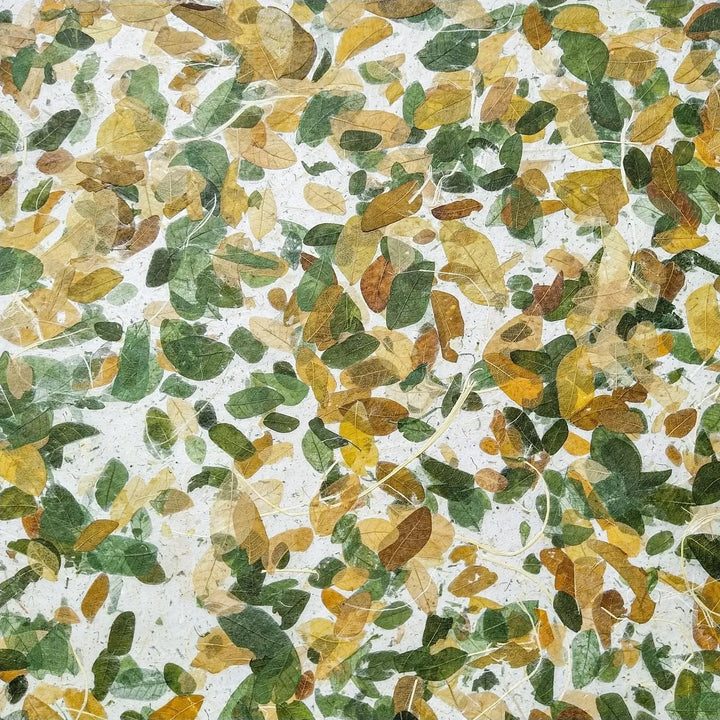 Handmade paper sheet from Kozo Studio with preserved Raintree leaves and durable kozo texture, highlighting the elegance of botanical mulberry paper.