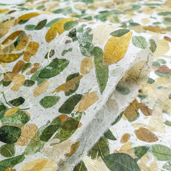 Kozo Studio’s Very Raintree Kozo Paper featuring real Raintree leaves, offering a unique handmade mulberry paper with long-lasting color and strength.