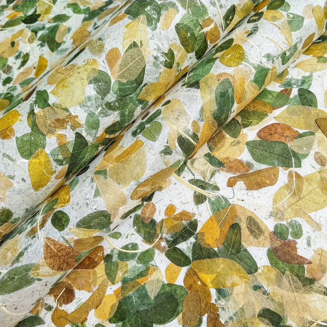 Close-up of Very Raintree Kozo Paper, a handmade mulberry paper from Kozo Studio, featuring real Raintree leaves for a natural and artistic finish.
