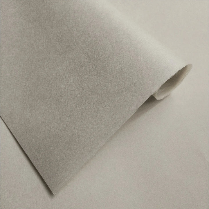 Fine-textured handmade paper by Kozo Studio, Conservator No.2 in natural gray, made from kozo pulp and captured under soft lighting to highlight its conservation-grade quality.