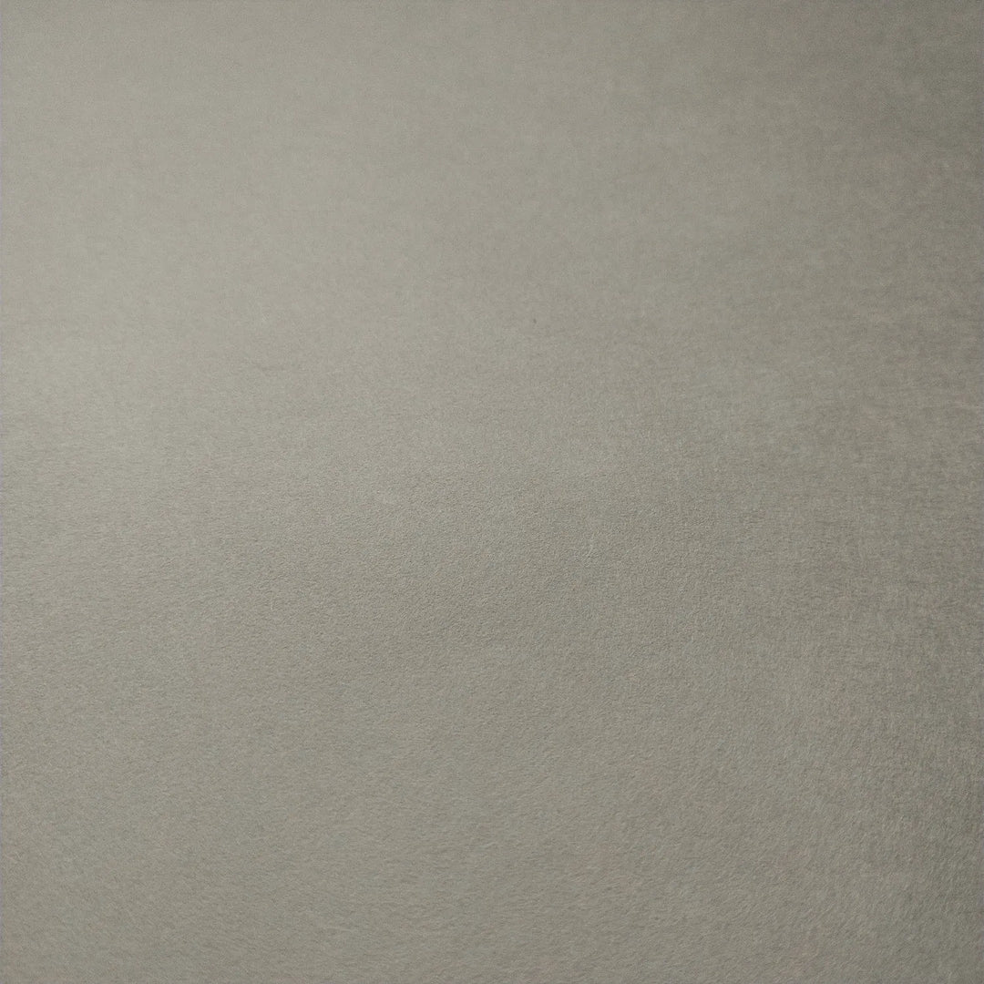 A detailed view of handmade mulberry paper from Kozo Studio, featuring Conservator No.2 with a light gray surface and subtle washi texture, perfect for archival preservation.