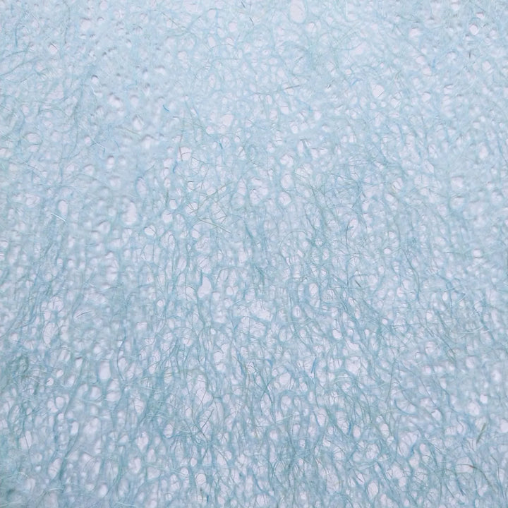 Detail view of Kozo Studio Asarakusui Lace Paper in light blue, showcasing handmade paper with a soft, airy texture and mulberry paper-like strands.