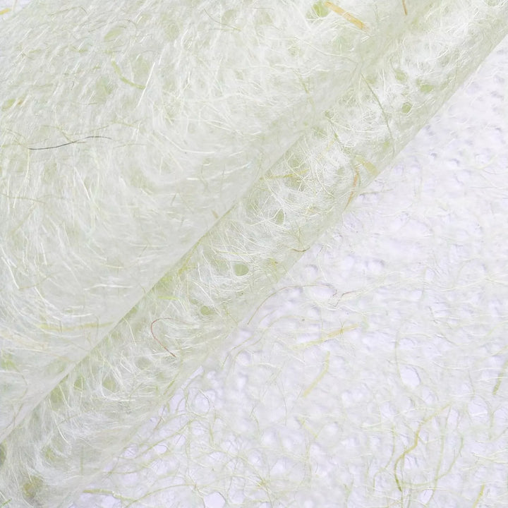 Translucent handmade paper from Kozo Studio in light green, showcasing the intricate fibers and natural texture of high-quality mulberry paper.