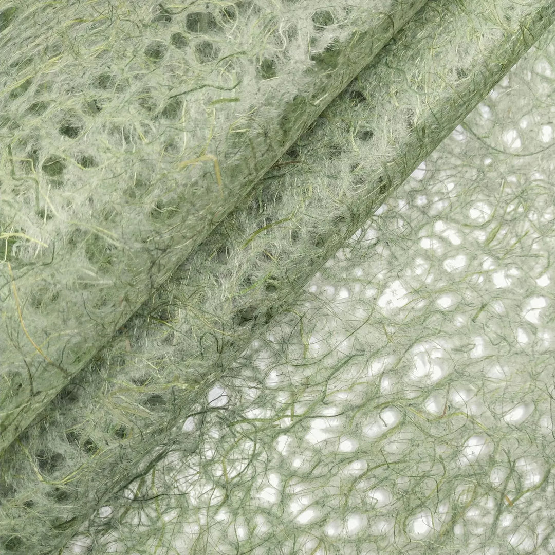 Kozo Studio Asarakusui Lace Paper in Moss shown in a close-up revealing layered mulberry fibers and the delicate pattern of this handmade paper.