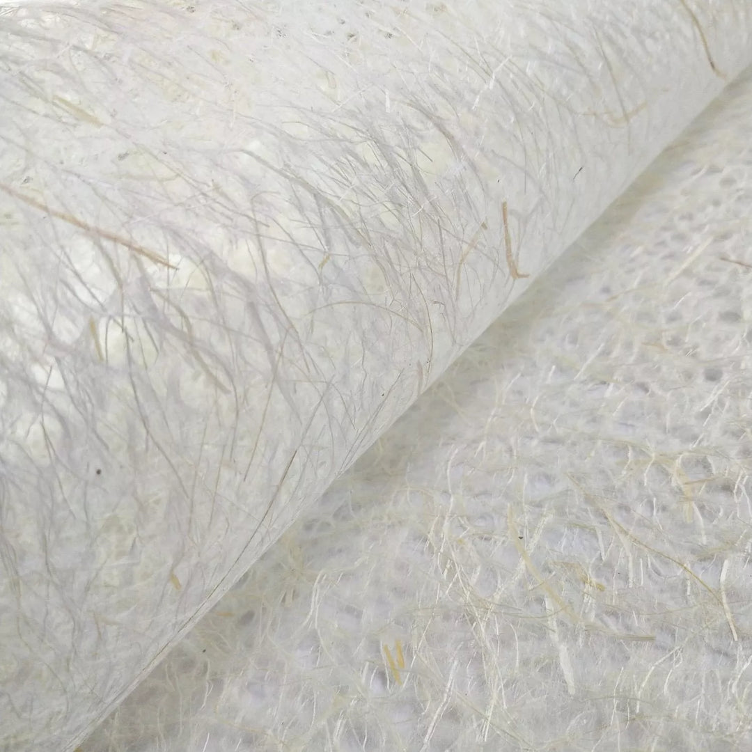 Close-up of Asarakusui lace mulberry paper from Kozo Studio, showing its translucent handmade texture with natural fibers and intricate threads.