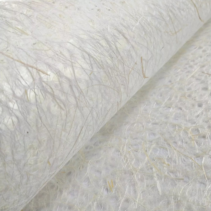 Close-up of Asarakusui lace mulberry paper from Kozo Studio, showing its translucent handmade texture with natural fibers and intricate threads.