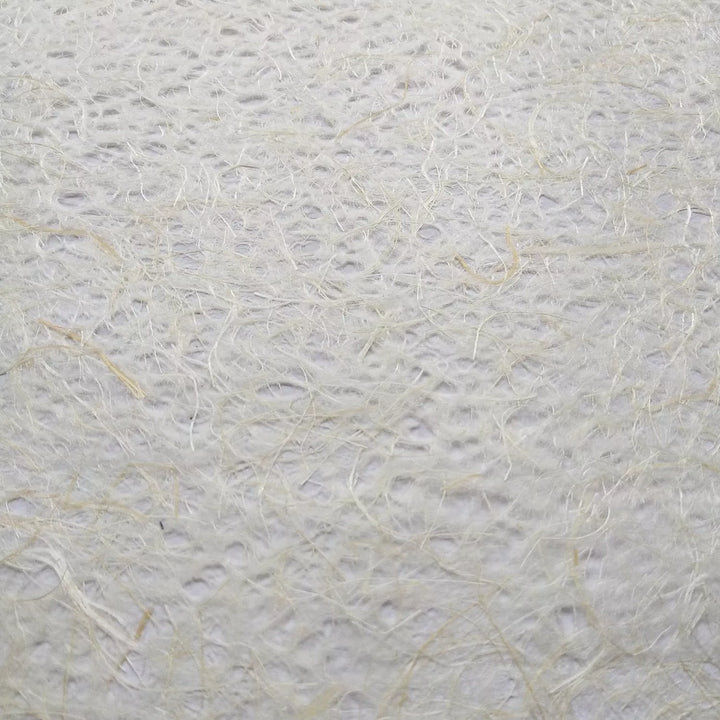 Rolled sheet of natural Asarakusui lace paper made from mulberry and abaca fiber at Kozo Studio, highlighting its artisanal handmade design.
