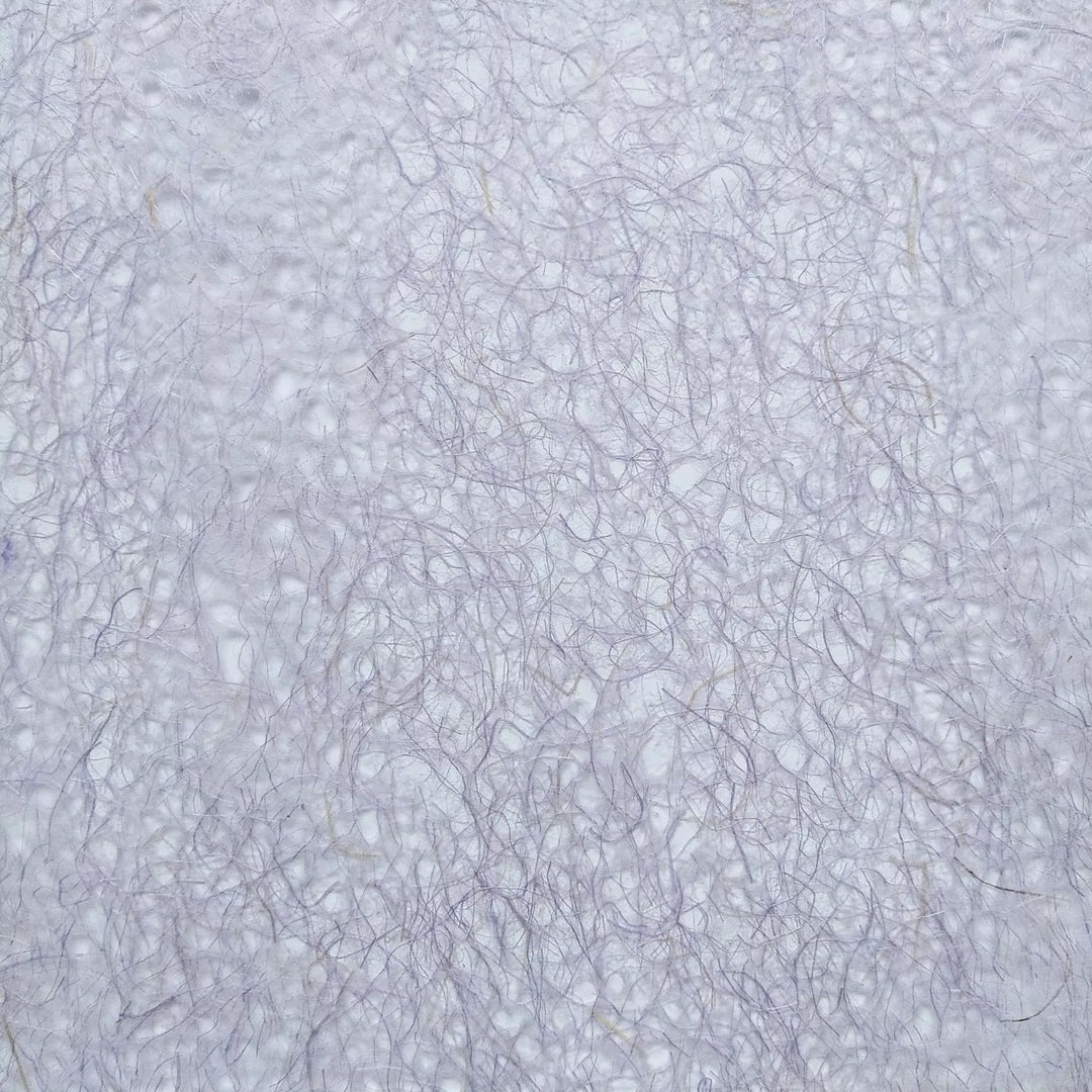 Close-up image of purple Asarakusui Lace mulberry paper by Kozo Studio showcasing its delicate, handmade paper texture and fine interwoven fibers.