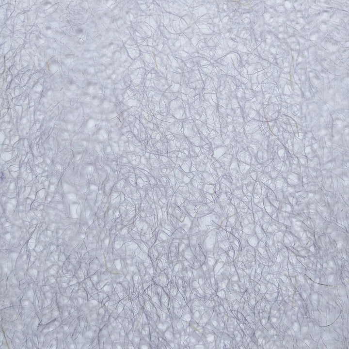 Close-up image of purple Asarakusui Lace mulberry paper by Kozo Studio showcasing its delicate, handmade paper texture and fine interwoven fibers.
