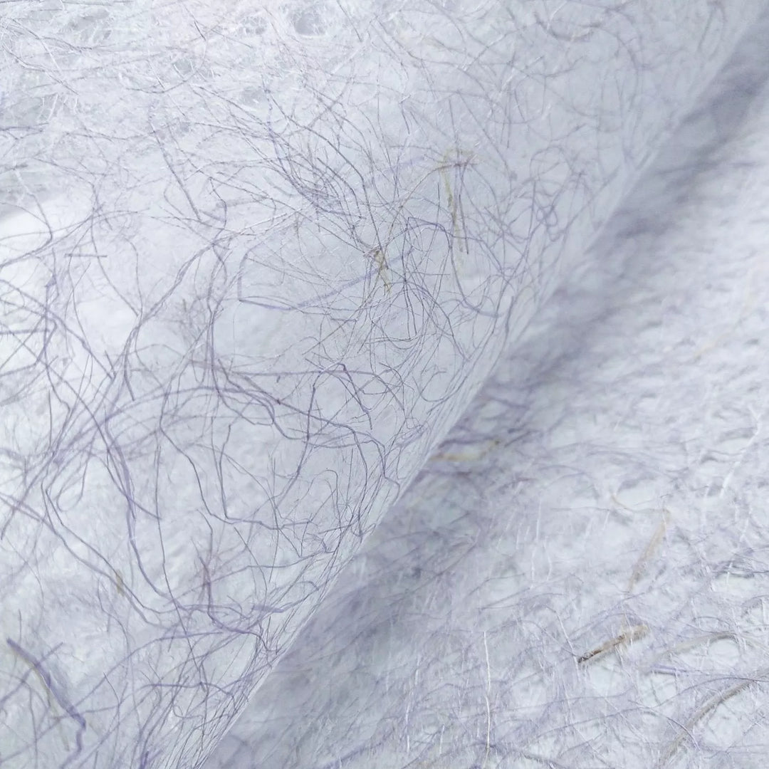 Fine-textured handmade paper by Kozo Studio in rich purple, showing the delicate fibers of their signature Asarakusui Lace mulberry paper.