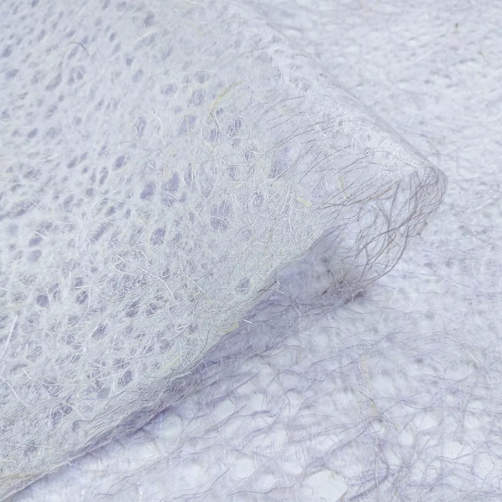 Detailed view of Kozo Studio Asarakusui Lace mulberry paper in purple, highlighting the thin, tangled fibers of this unique handmade paper.