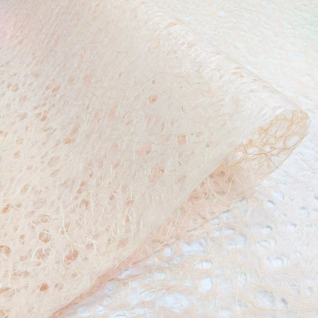 Kozo Studio handmade paper in Old Rose, a close-up of Asarakusui Lace Paper with a natural mulberry fiber pattern and lace-like appearance.