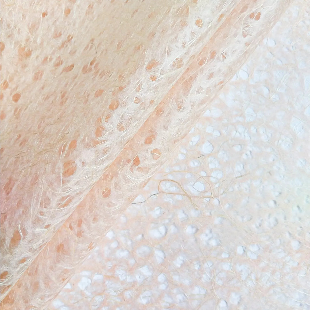 Artistic view of Old Rose Asarakusui Lace Paper crafted by Kozo Studio, made from fine mulberry paper and featuring a unique fibrous handmade texture.