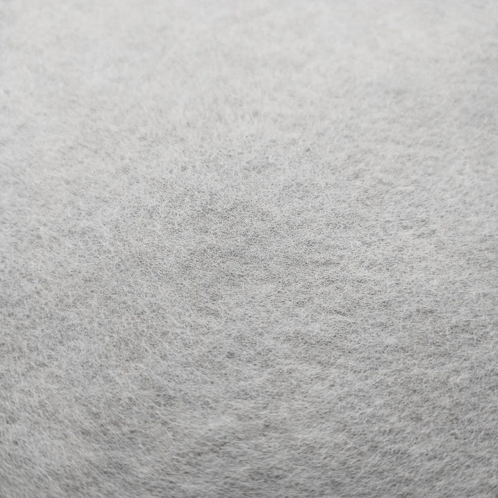 Close-up of Conservator No.1 by Kozo Studio: a soft, light gray, slightly uneven surface, resembling dense fibers and traditional washi paper made from kozo pulp. (8.5 gsm; 15 sheets/pack).