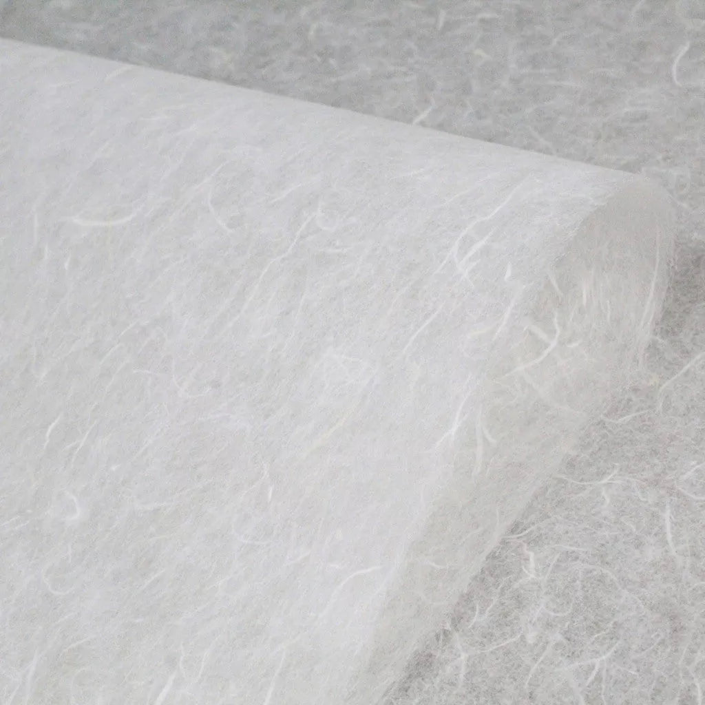A close-up of Water-resistant Kozo Paper (White) by Kozo Studio shows its fibrous texture similar to mulberry paper. The lightweight, slightly translucent non-woven fabric suits various uses like filtration or crafting.