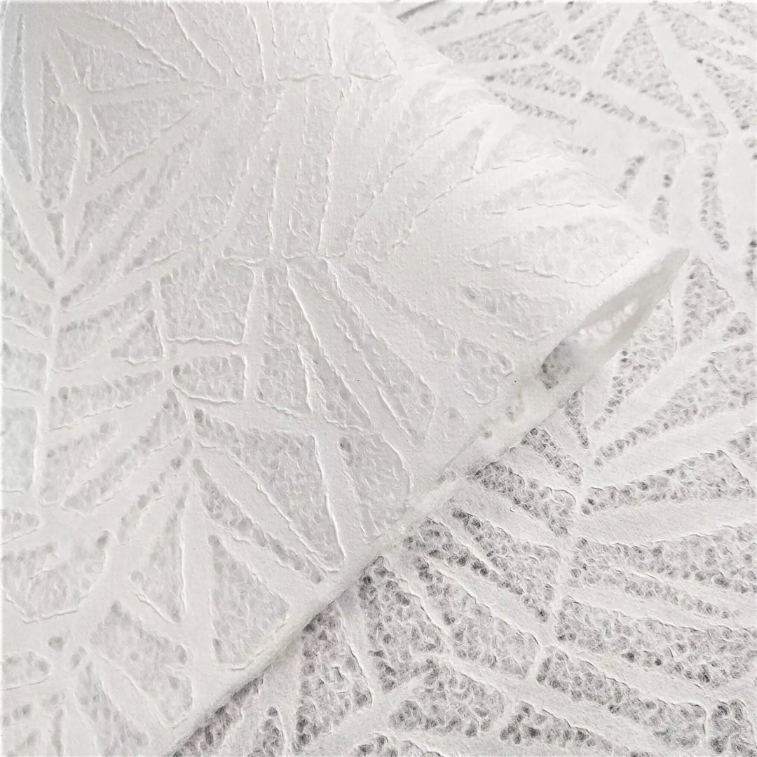 Close-up of Handmade Lace Kozo Paper (Bamboo) by Kozo Studio, showcasing white lace with an overlapping bamboo leaf pattern.