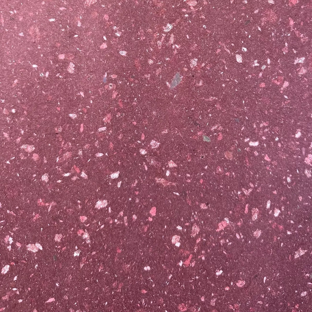 Eco-friendly handmade paper crafted at Kozo Studio using kozo pulp and recycled newspaper fragments. This medium-thickness mulberry paper features a unique speckled finish.