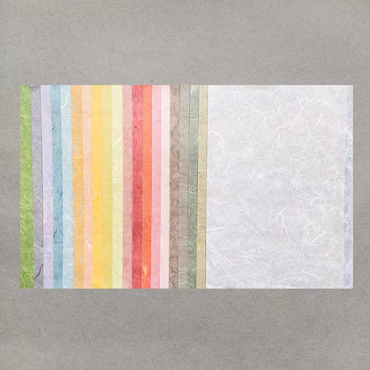 Kozo Studios Assorted A4 Pastel Unryu Kozo Paper Set features vertically arranged pastel colors, including green, yellow, pink, and orange mulberry papers.