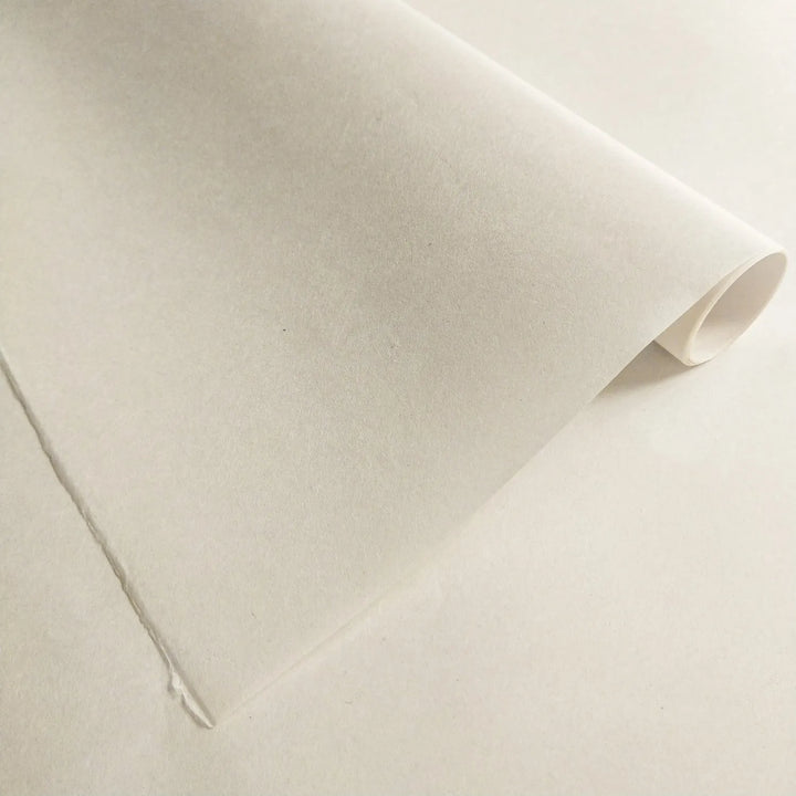 Image of premium mulberry paper by Kozo Studio, showcasing smooth, semi-translucent handmade paper surface used for woodblock printing and other art projects.