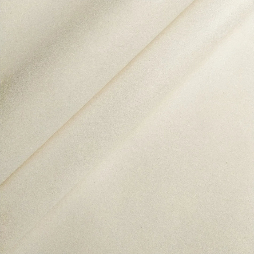 Photograph of 45 gsm handmade mulberry paper by Kozo Studio, highlighting its natural off-white tone, smooth feel, and versatility for arts and crafts.