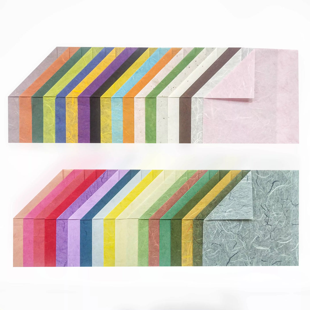 The Origami Unryu Kozo Paper Pack by Kozo Studio (6x6 in., 72 sheets) features colorful textured mulberry papers in red, blue, green, pink, and yellow. The papers are arranged in two angled rows for an overlapping layered effect.