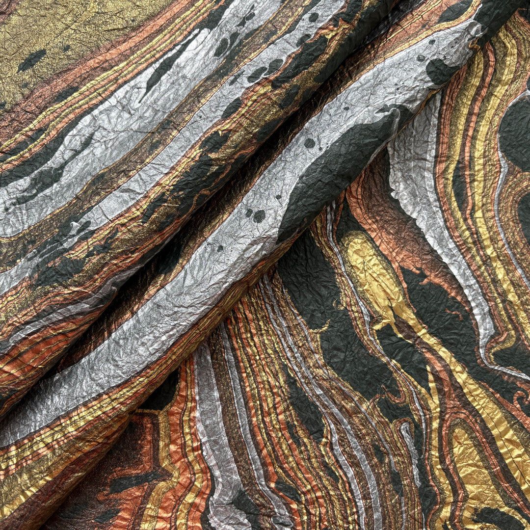 Milano Kozo Paper – Design 9 (Green) embodies artisanal beauty with its graceful marbled design. Handmade by delicately layering mulberry paper over swirling oil-based colors, each sheet boasts a distinct, one-of-a-kind pattern and a soft, fabric-like crinkled texture. Its sophisticated look and exceptional quality make it ideal for creative projects, detailed crafts, or as a striking decorative statement on its own.