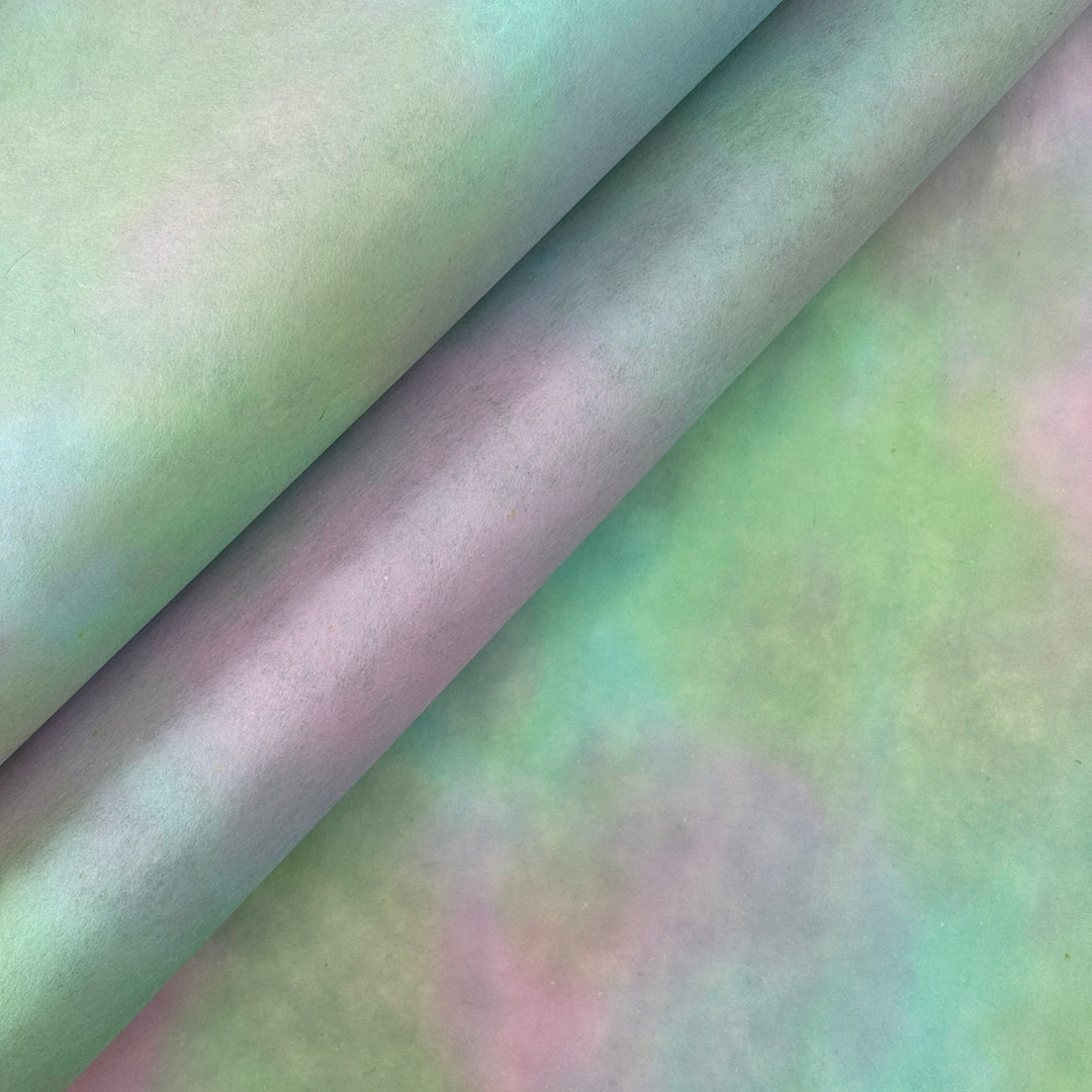 Hand-colored pink and green ombre mulberry paper with a mottled watercolor texture.