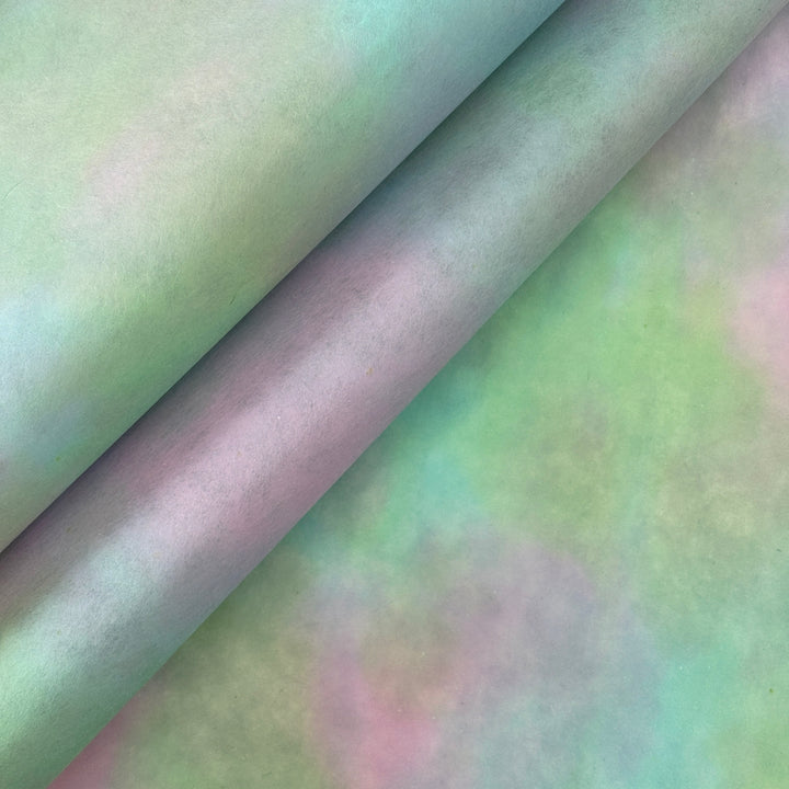 Hand-colored pink and green ombre mulberry paper with a mottled watercolor texture.
