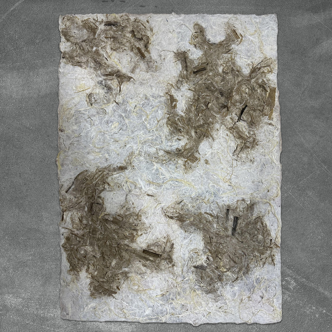 Artistic handmade paper by Kozo Studio featuring rugged mulberry texture and an organic color blend ideal for collage, lampshades, and mixed media.