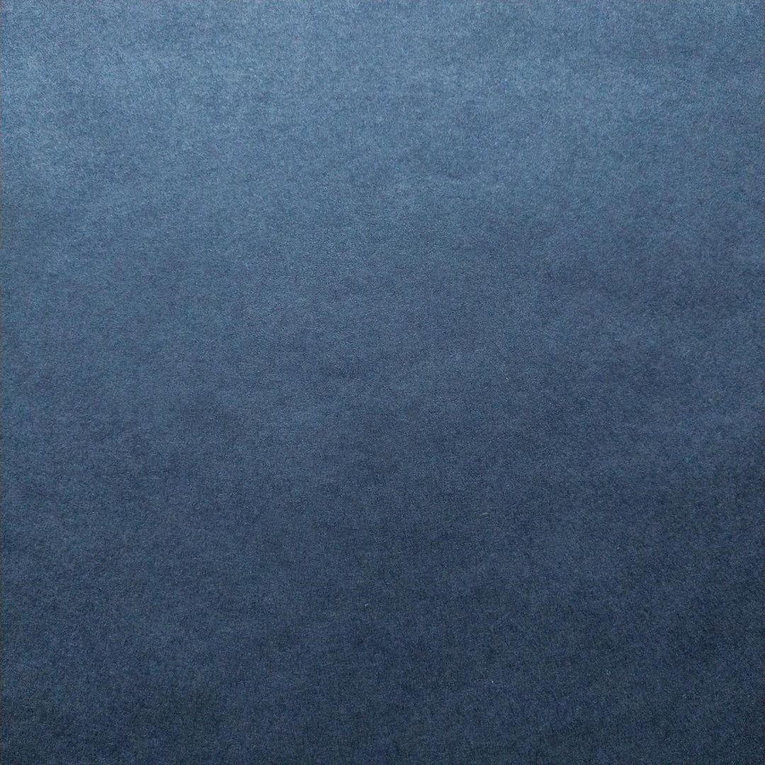 Denim blue Kozo Studio handmade paper captured in natural light to reveal the subtle texture of mulberry paper.