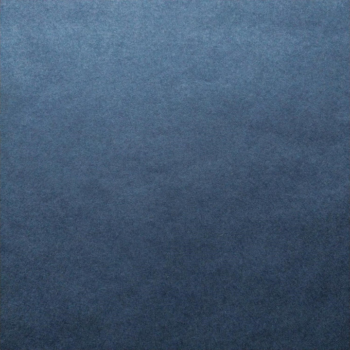 Denim blue Kozo Studio handmade paper captured in natural light to reveal the subtle texture of mulberry paper.