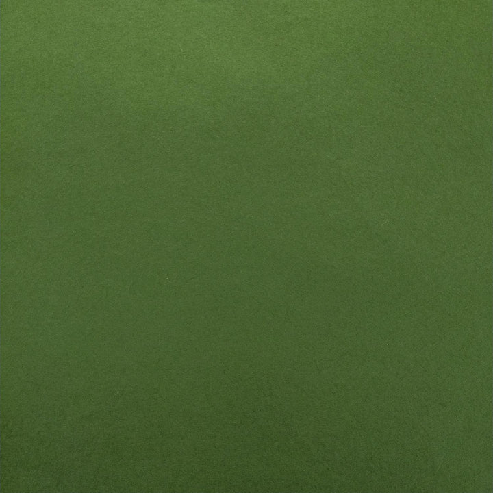 Detailed photo of Kozo Studio handmade mulberry paper in a rich fern green shade, with delicate folds adding depth and subtle contrast.