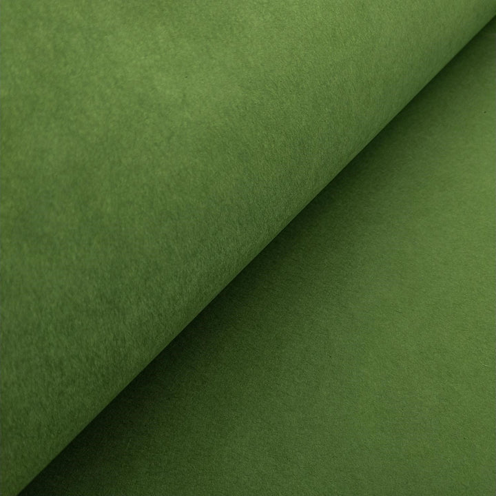 High-resolution image of solid-colored mulberry paper from Kozo Studio, showing the soft folds and smooth handmade texture in fern green.