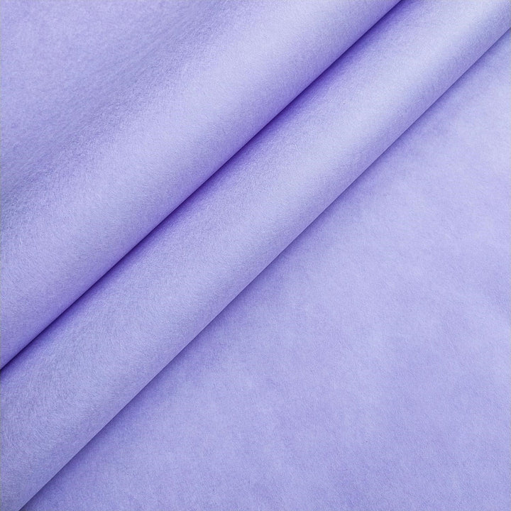 Heather purple mulberry paper from Kozo Studio, highlighting the thickness and soft surface of this handcrafted paper.